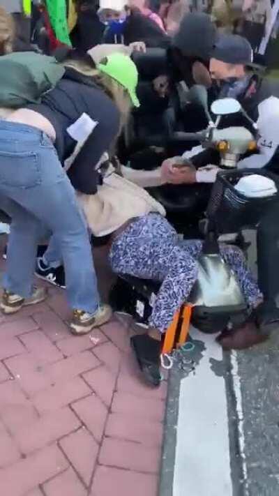 Police pepper spray people, including children, marching to the polls in Alamance County, North Carolina. Several of the children vomited; a woman is seen falling out of a wheelchair. Many of the the voters were ultimately turned away from the polls.