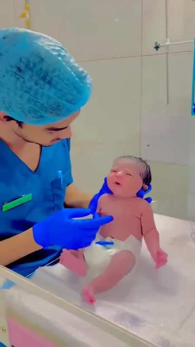 Testing a newborn baby's startle reflex