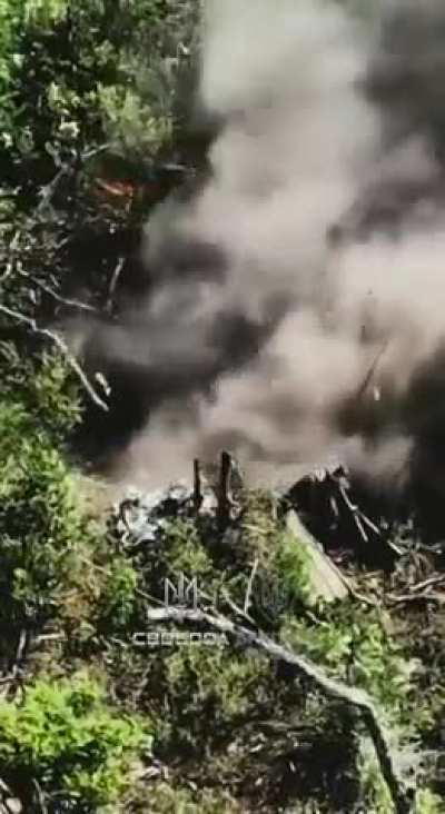 Half buried Russian soldier is mercy killed by Ukrainian fpv drone.