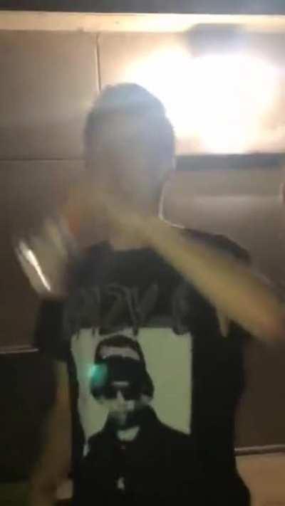 Throwing a glass bottle at a wall