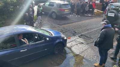 Idiot getting a tow with steering lock on?