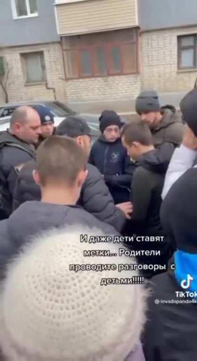 People caught a teenagers when they were drawing marks (for Russians, I guess).