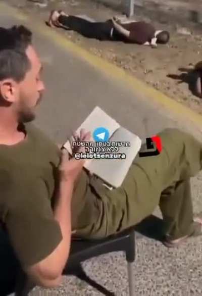 Leaked footage shows Israeli occupation soldiers torturing Palestinian detainees arrested from the occupied west bank, lying on the ground and on the stones. Meanwhile, an Israeli soldier seemingly reads the Jewish Torah book and provokes them.