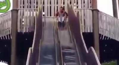 Man goes down slide