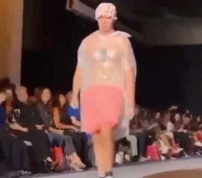 This man simply walked into the fashion show wearing a garbage bag - and no one thought it was strange until security removed him.