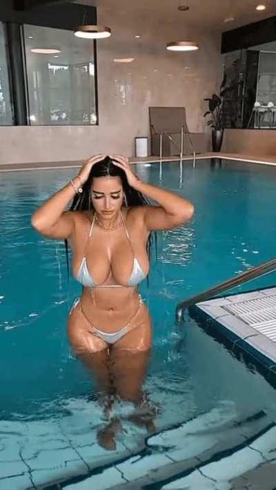 A rare moment where she wears a bikini just in the pool