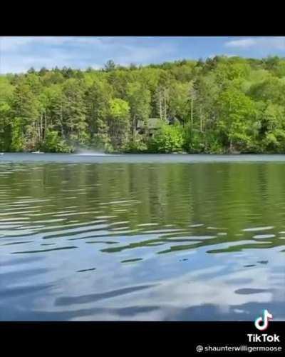 A powerful water spout throws things around