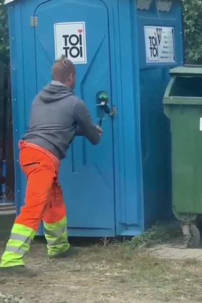 Trying to open a locked toilet.