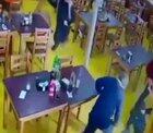 Group of men try to rob a restaurants. Patrons and owner fights back.