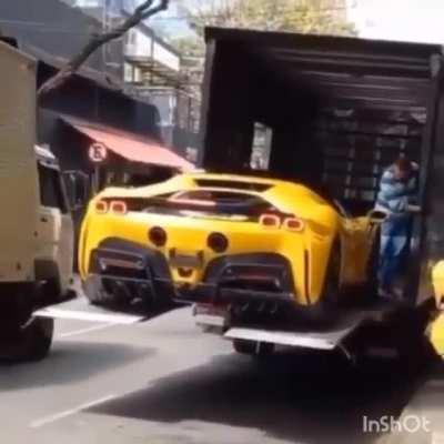 Brand new Ferrari SF90 worth half a million usd falls from delivery truck in São Paulo, Brazil