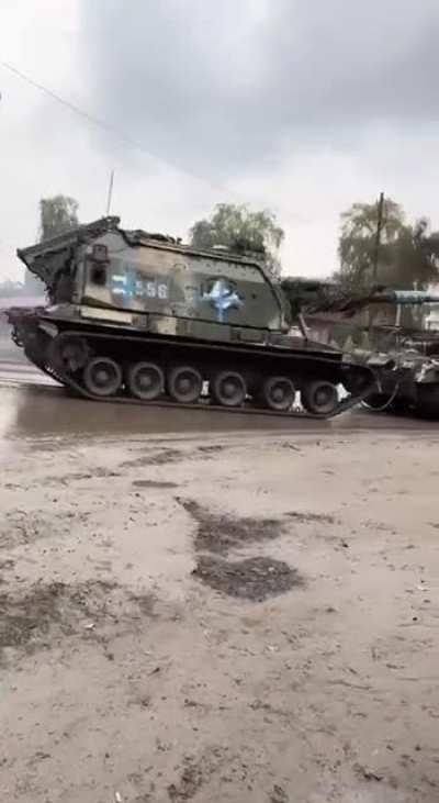 Ua pov Captured Russian tank towing a captured MSTA-S SPG