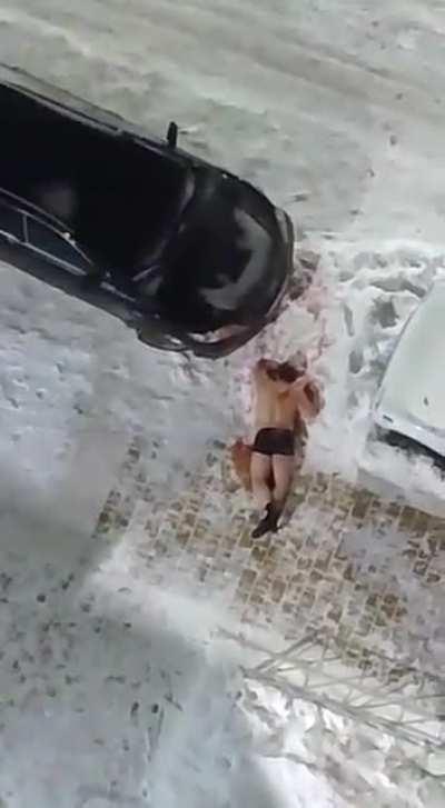 Footage caught a man diving out of his apartment window and into the pavement