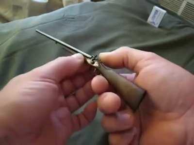 A miniature shotgun that shoots
