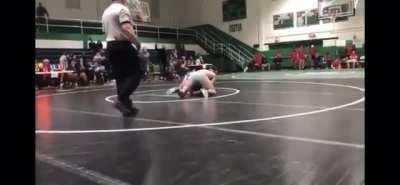Father tackles son’s opponent after illegal move at high school wrestling match