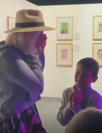 Nephew surprises his aunt with a painting he made of her that earned finalist placement in an art competition