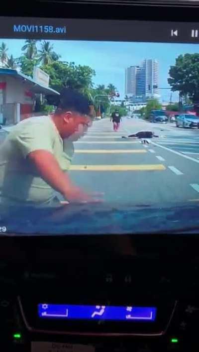 A coconut fell straight on a biker's head.