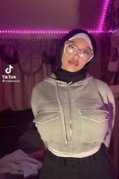 She’s been trying to hide them lately, but she’s literally too busty to hide!