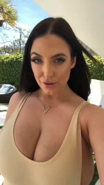 Angela walks for us again. Her top can hardly hold her breasts in.