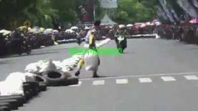 Motorcycle rider purposefully crashes competitor during race. What comes around goes around