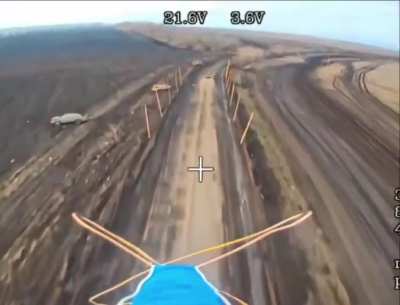 Russian fiber-optic FPV drone laying in wait, until a Ukrainian pickup truck passes by