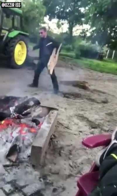 Just film as your clearly drunk buddy stumbles around with some firewood.