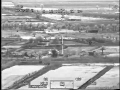 AH-64 Apache taking out a building suspected of hiding IED team in Iraq in 2007, seen through the FLIR of an accompanying AH-64