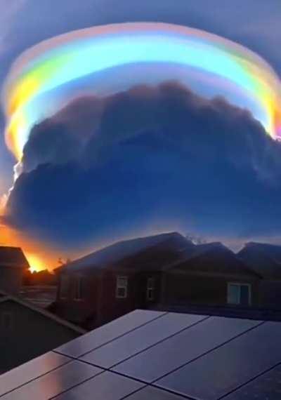 An iridescent pileus cloud