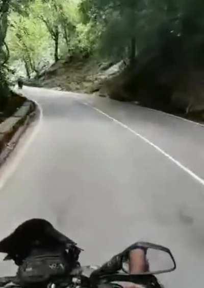 biker got wiped out by falling rock