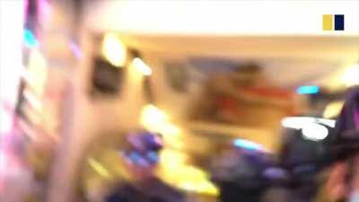 6.12 Female student kneeled on head by riot police