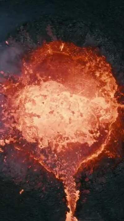 Look at how close he flies his drone to sputtering lava