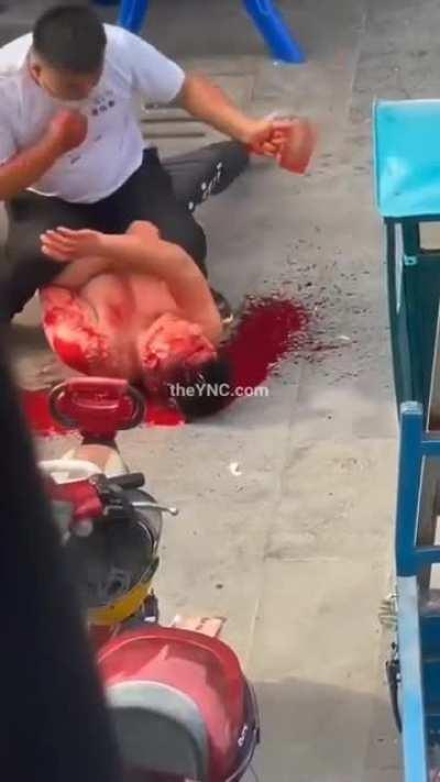 Man gets bonked in the head repeatedly with a mug.