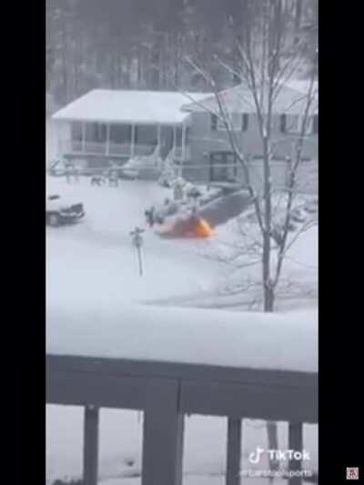 Guy uses flamethrower to melt snow