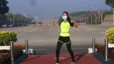 This woman from Myanmar was recording her aerobics class. Unbeknownst to her, she records the military Junta arriving to the parliament for a coup d'etat in the background