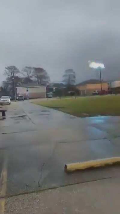 Hotline! Ball of electricity shoots across a frozen power line during the savage winter storms across the south.