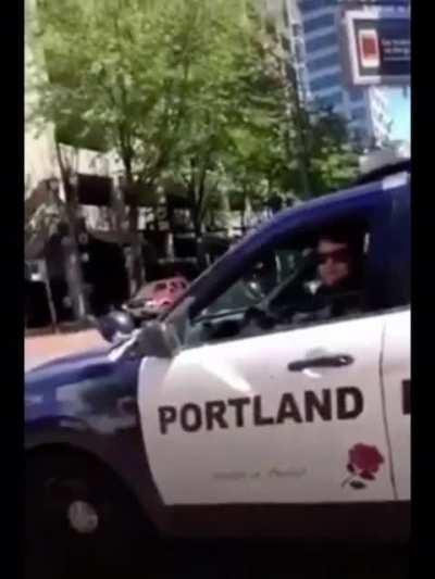 Girl asks Portland PD for help because guys are shooting people with paintball/airsoft gun from the top of a building as well as bear macing people. Cop: “There’s nothing I can do about that right now.”