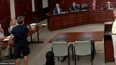 Bedminster, NJ: During public comments on proposed parking restrictions near Trump National Golf Club, a Trump supporter from out of town heckles a local father speaking in favor, tells him to 