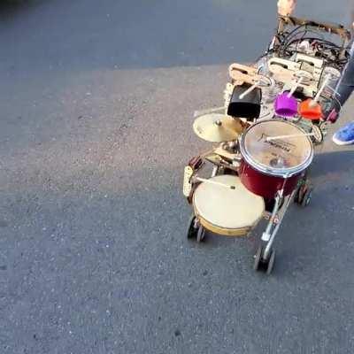 Useless, but fun, musical robot in a stroller