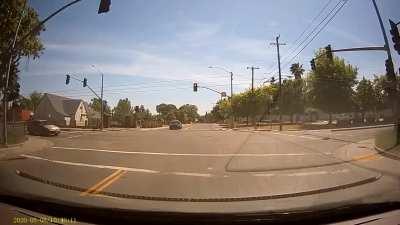 [USA] Running a red light in front of the police station..