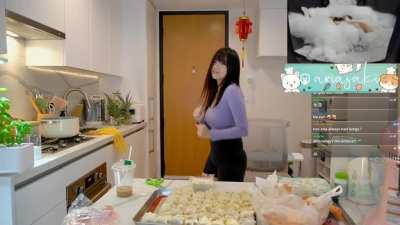 Aria dancing while cooking