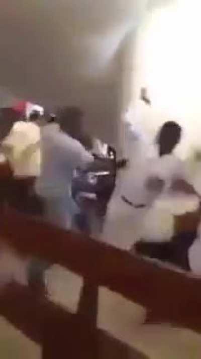 African pastor tells churchgoers to beat the demons out of each other. Mass brawl ensues