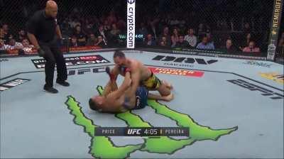 as Price is complaining to the ref, Pereira masterfully gets to mount.