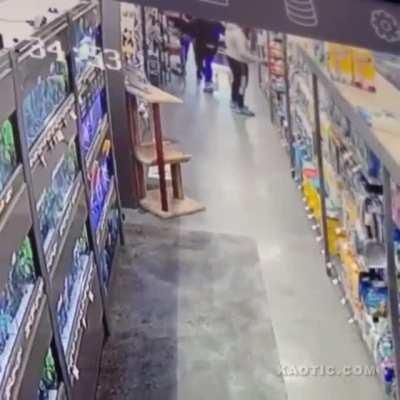 Dallas Man smelling a pet store customers behind.