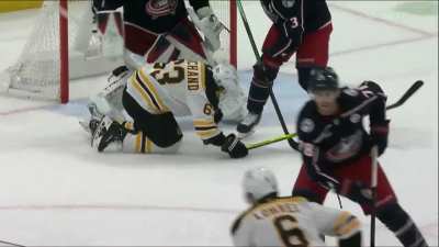 Marchand takes a (uncalled) chop to the balls from Johnson and a puck to the ass from Lohrei