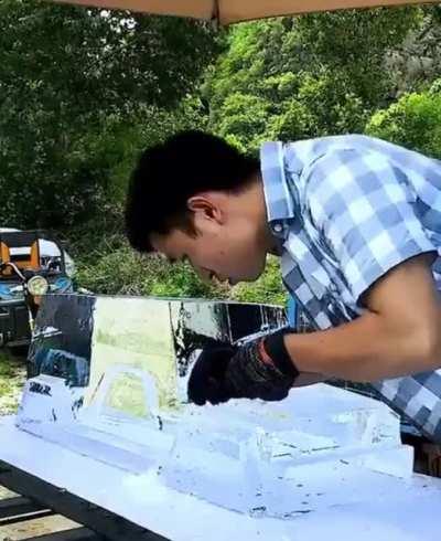 guy sculpts a jeep (i think) with ice, most satisfying stuff ive seen
