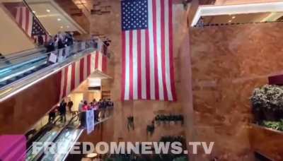 Protestors assembly inside Trump Tower shouting 
