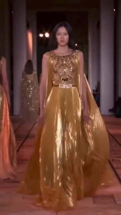 Golden haute couture runway walk