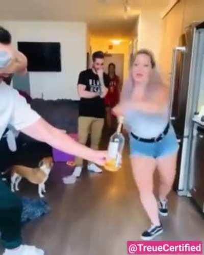 Trying to kick the top off a bottle