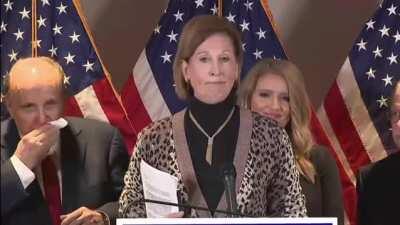 Rudy blows nose and wipes it all over face.