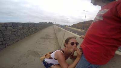 Giving him a public blowjob in the highway [GIF]
