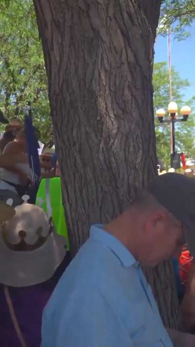 MAGA agitator attempts to draw pistol on peaceful No Kings protestors, is then tackled by those around her.